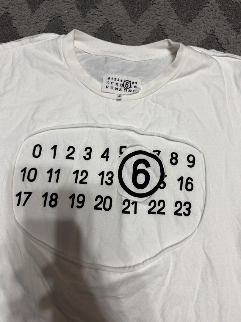 Maison Margiela - Cut Out Front Logo White Tee (Category: Tshirts & Polo Shirts ) located in Cavite. Submitted by commoncourtesy (Listing ID 1458883263, Image 2). Description: Authentic Size medium.