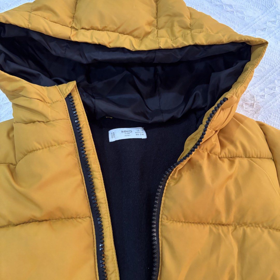 Mango Kids Yellow Puffer Jacket 12-18 Months (Category: Babies & Kids Fashion) located in Cavite. Submitted by decluttererminer (Listing ID 1458698870, Image 3). Description: - Yellow puffer jacket from Mango Kids - Lined with black fleece for extra warmth - Hooded design - Zipper closure with pockets - Size: 12-18 months / 86cm - Ideal for cold weather - first owner : my daughter (can be used by boys also) - rfs: outgrown - authentic - washed - 