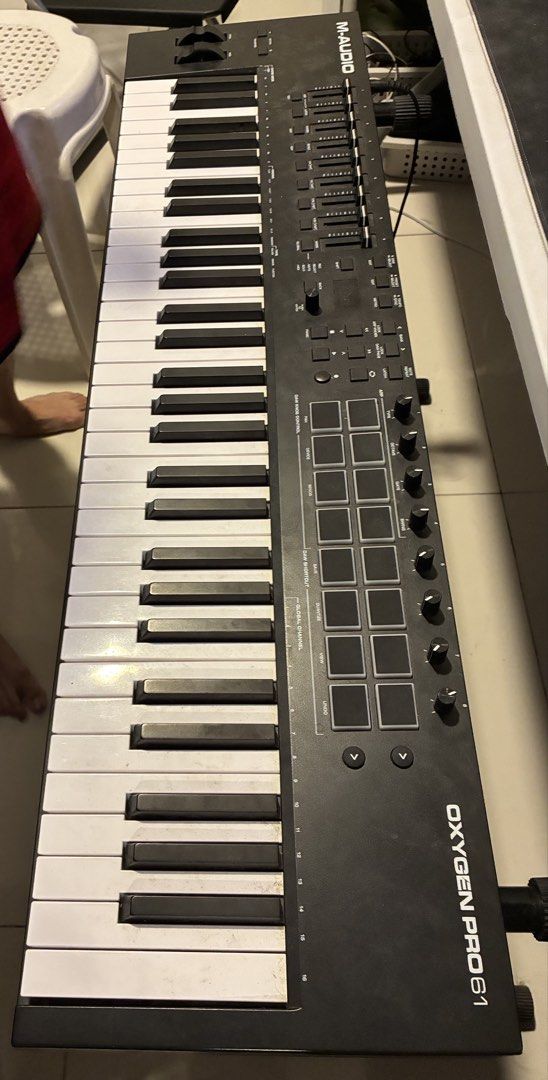 M-Audio Oxygen Pro 61 MIDI Keyboard Controller (Category: Musical Instruments) located in Manila. Submitted by christophe39846 (Listing ID 1458752431, Image 1). Description: M-Audio Oxygen Pro 61 MIDI Keyboard Controller + Stand | 61 Keys Selling my M-Audio Oxygen Pro 61 MIDI Keyboard Controller with keyboard stand. • 61 semi-weighted keys with aftertouch • 16 RGB-backlit pads • 8 assignable knobs + 9 faders • Smart Chord & Smart Scale • Built-in