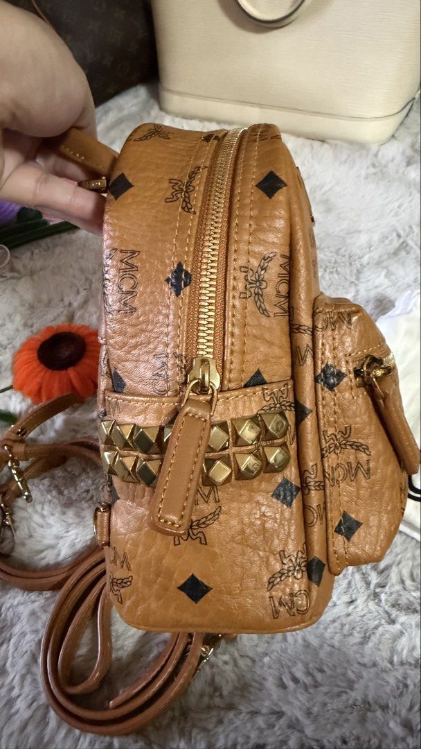 MCM Mini Backpack Cognac Visetos Studded (Category: Backpacks) located in Angono. Submitted by sam.sam15 (Listing ID 1458704476, Image 3). Description: - Authentic MCM Mini Backpack - Classic cognac Visetos print - Gold stud details - Adjustable straps - Includes dust bag - Compact size, perfect for essentials - Ideal for everyday use or travel .