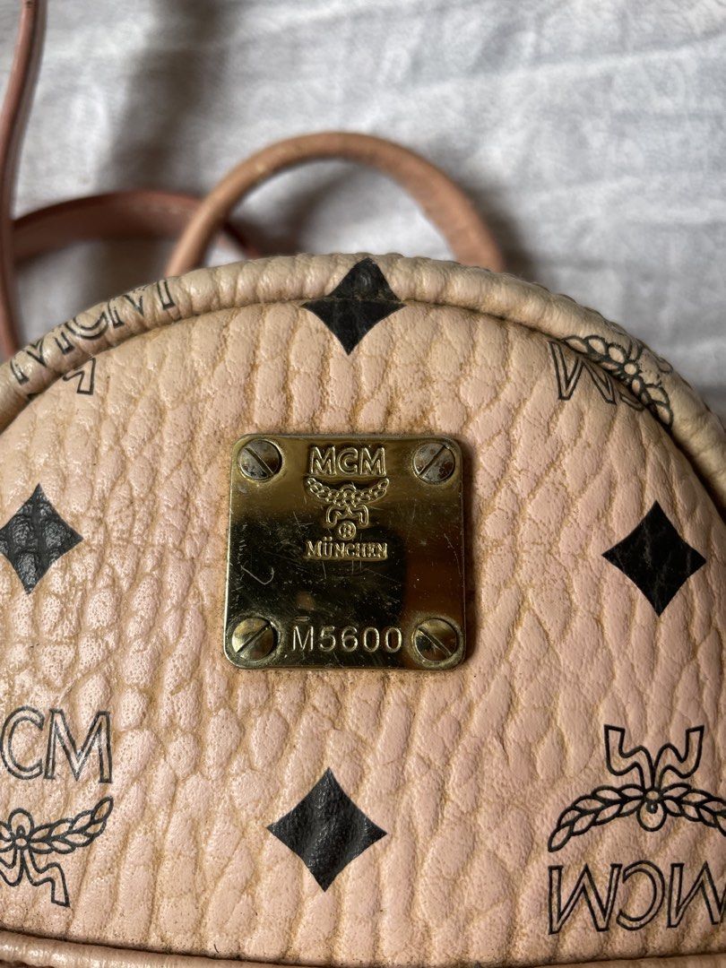 MCM Mini Backpack Pink Monogram Studded (Category: Backpacks) located in Cavite. Submitted by msandysgoodies (Listing ID 1458713829, Image 2). Description: - Authentic pink MCM mini backpack - Iconic monogram print - Gold hardware with stud details on front pocket - Adjustable straps for a comfortable fit - Compact size, ideal for carrying essentials - Shows some signs of wear on leather and hardware, adding to its character.