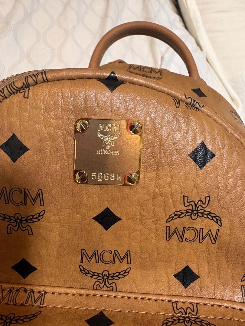MCM Visetos Stark Backpack Mini Cognac (Category: Luxury Bags & Wallets) located in Quezon City. Submitted by mc397m (Listing ID 1458877896, Image 2). Description: LOCATION: VISAYAS AVENUE QC - Classic MCM MINI backpack - Leather interior - Iconic Visetos print - Color: Cognac - Hardware: Gold - Comes with dust bag Pls message for bundle.