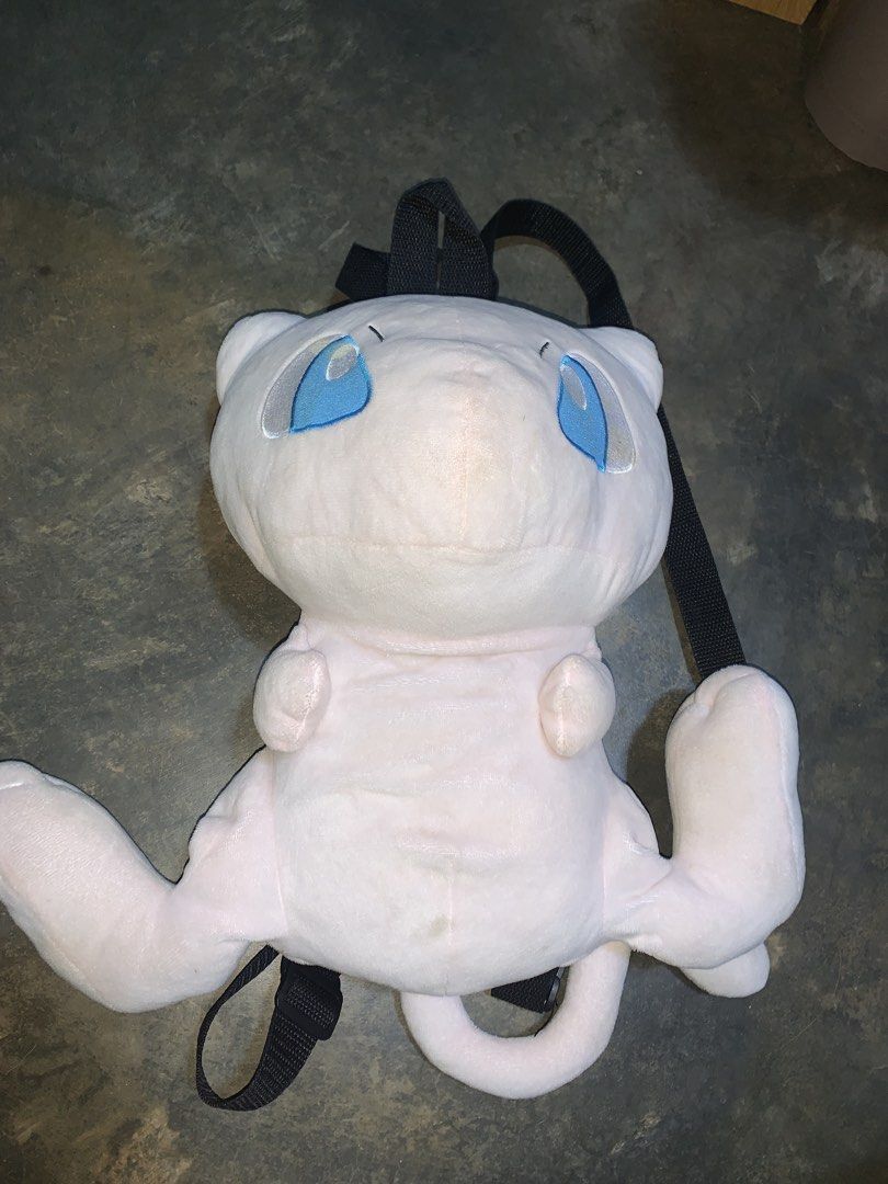 Mew Pokemon Plush Backpack Bag (Category: Backpacks) located in Binan City. Submitted by kariray_shop (Listing ID 1458720087, Image 3). Description: - Adorable Mew plush backpack - Adjustable straps for a comfortable fit - Zippered main compartment accessible from the back - Soft and cuddly material - Ideal for Pokemon fans and everyday use - Perfect for carrying essentials on the go.