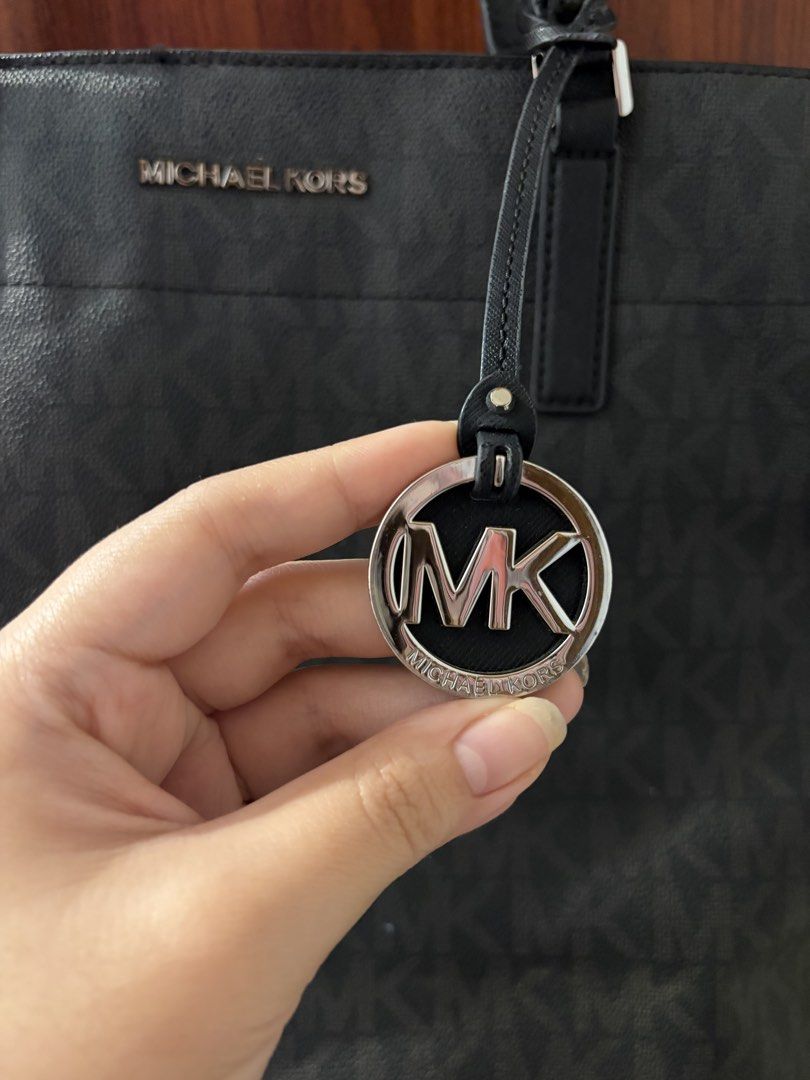 Michael Kors Black Monogram Tote Work Bag (Category: Luxury Bags & Wallets) located in Quezon City. Submitted by robinbatsky (Listing ID 1458707314, Image 2). Description: Rfs: don’t use it anymore Michael Kors all over print monogram bag Spacious tote bag perfect for everyday work bag Compartments make it organized Used with care!.
