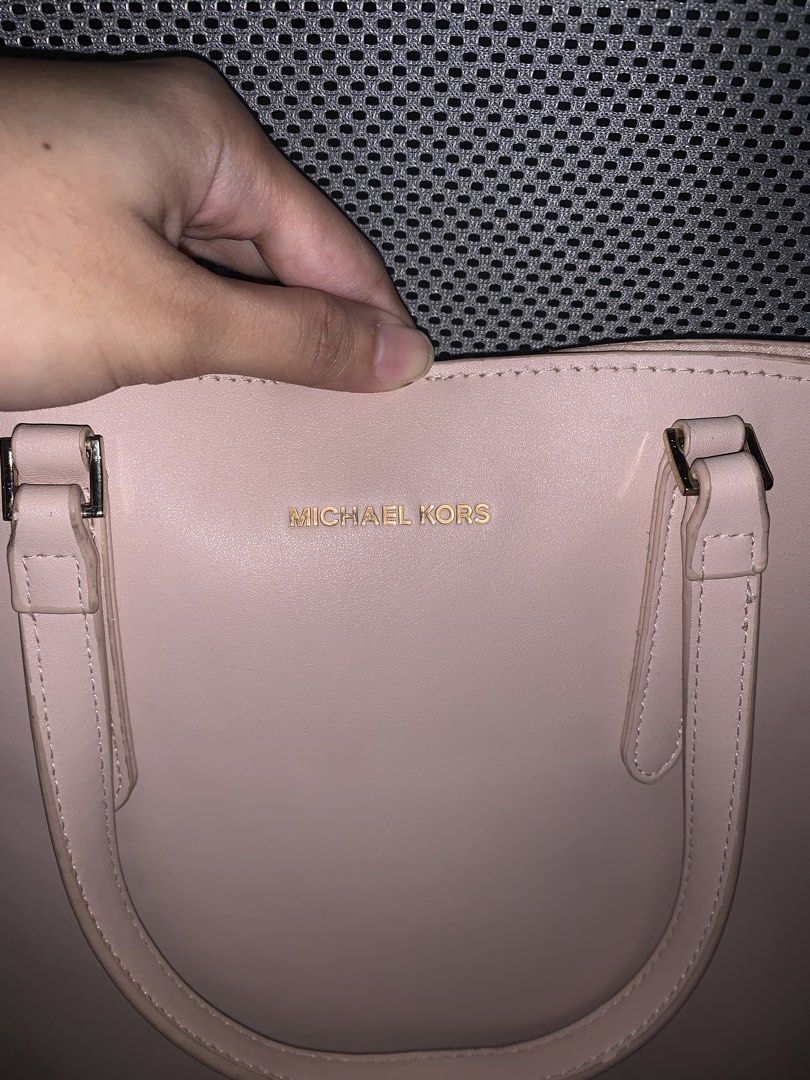 Michael Kors Pink Tote Bag (Category: Tote Bags) located in Manila. Submitted by _wtfrn (Listing ID 1458708047, Image 3). Description: 📌Authentic Michael Kors tote bag in pink color. 📌Detachable strap with all-over Michael Kors logo. 📌Spacious interior, ideal for everyday essentials or travel. 📌Bag is clean and in excellent, well-maintained condition. 📌Color may vary due to lightning 📍Quezon City 🛵Lalamove & Meet up nearby 💌: message me i