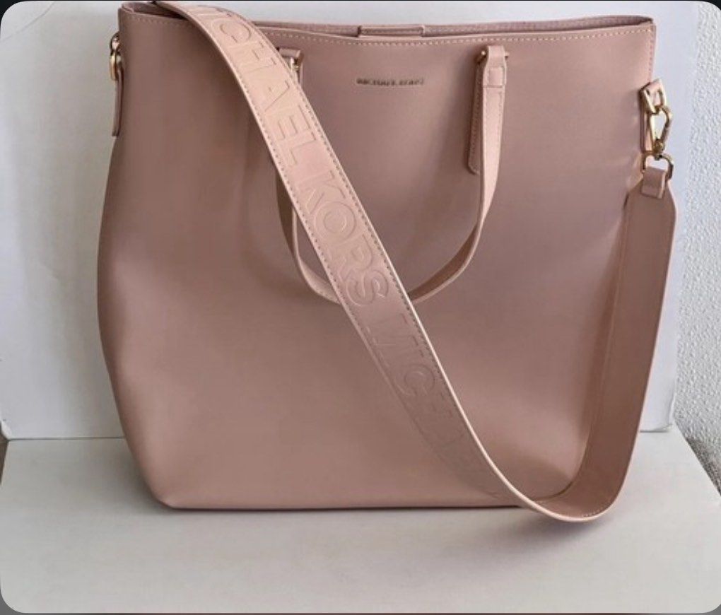 Michael Kors Pink Tote Bag (Category: Tote Bags) located in Manila. Submitted by _wtfrn (Listing ID 1458708047, Image 1). Description: 📌Authentic Michael Kors tote bag in pink color. 📌Detachable strap with all-over Michael Kors logo. 📌Spacious interior, ideal for everyday essentials or travel. 📌Bag is clean and in excellent, well-maintained condition. 📌Color may vary due to lightning 📍Quezon City 🛵Lalamove & Meet up nearby 💌: message me i