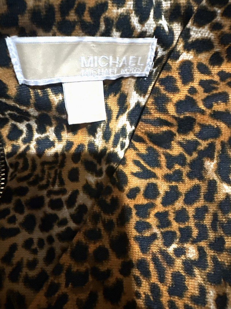 Michael Michael Kors Leopard Print Panel Black Dress Size 16 (Category: Dresses) located in Manila. Submitted by classictrends_24 (Listing ID 1458647478, Image 3). Description: - Stylish black dress - Eye-catching leopard print panel down the front - Long sleeves for added coverage - Convenient back zipper closure - Versatile for both work and night out occasions - Proudly made in Indonesia.