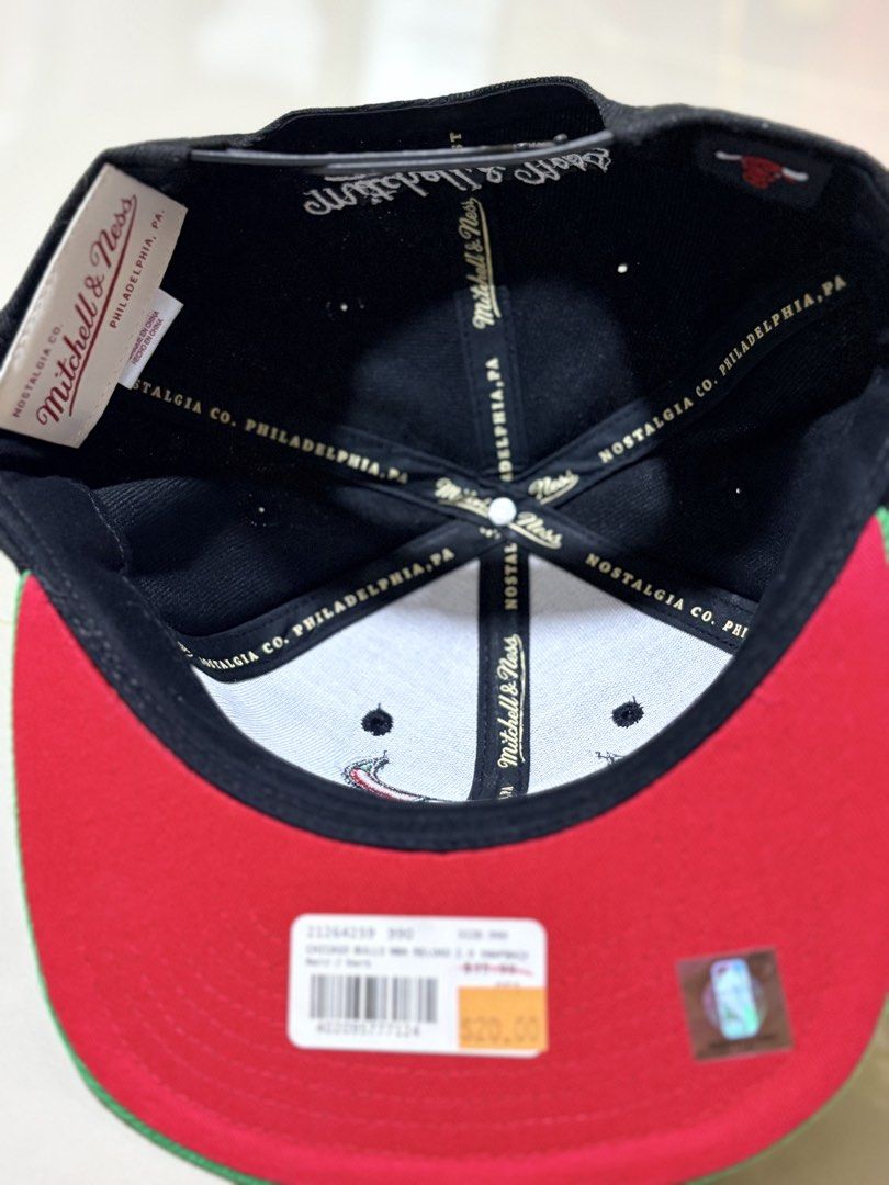 Mitchell & Ness Chicago Bulls Snapback Cap (Category: Caps & Hats) located in Subic. Submitted by aralleiah (Listing ID 1458766429, Image 2). Description: - Mitchell & Ness Chicago Bulls snapback cap - Color: Black with green brim - Features iconic red Bulls logo - Original fit - Brand new with tag still attached - A must-have for any Chicago Bulls fan!.