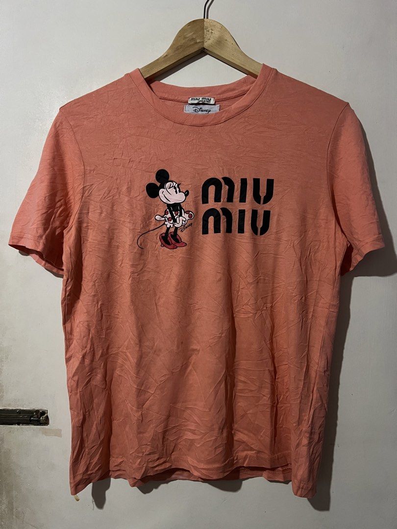 MIU MIU x DISNEY SHIRTS (Category: Others Tops) located in Manila. Submitted by dailystrategythrift (Listing ID 1458729972, Image 1). Description: MIU MIU x DISNEY SHIRTS CUT WASHTAG! WIDTH - 19 LENGTH - 26 EXCELLENT CONDITION.