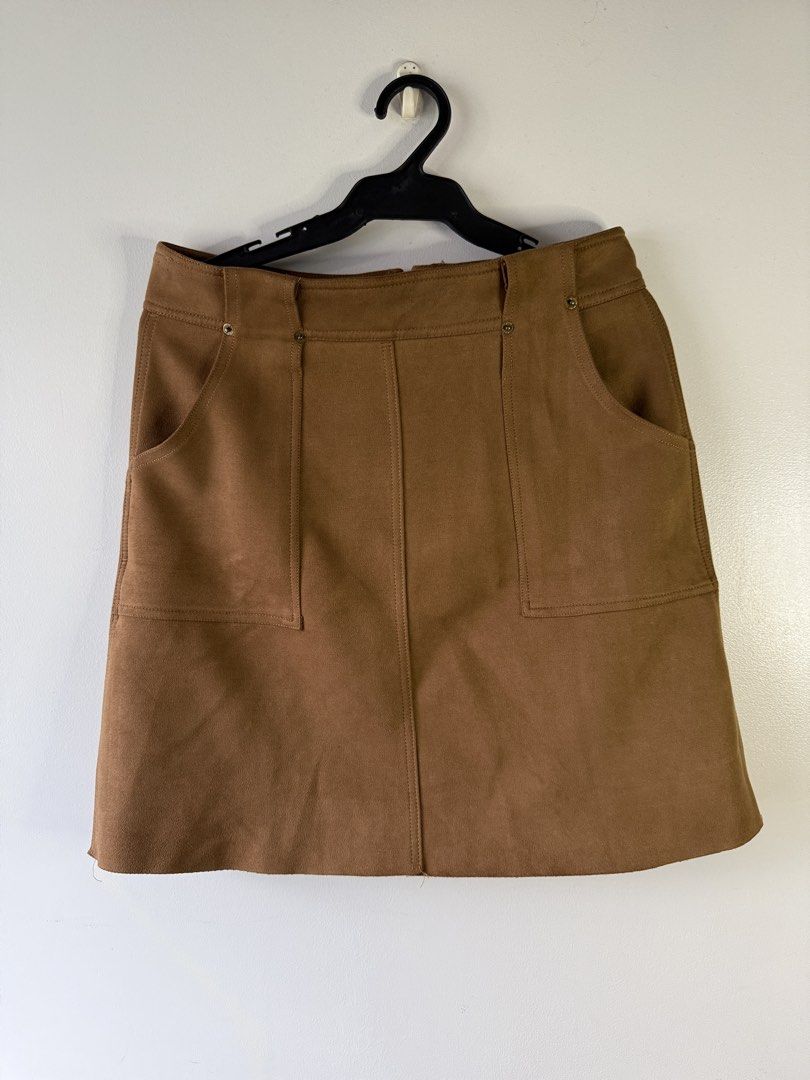 MO&CO. Brown Suede A-Line Mini Skirt (Category: Skirts) located in Makati City. Submitted by secondlife.inventory (Listing ID 1458766980, Image 1). Description: - Brand: MO&CO. - Material: Brown Suede - Style: A-line Mini Skirt with Lining - Features: Front Pockets - Versatility: Great for casual or dressed-up outfits - condition: 10/10 - fits M-L Pick Up BGC MOP GCash MariBank.