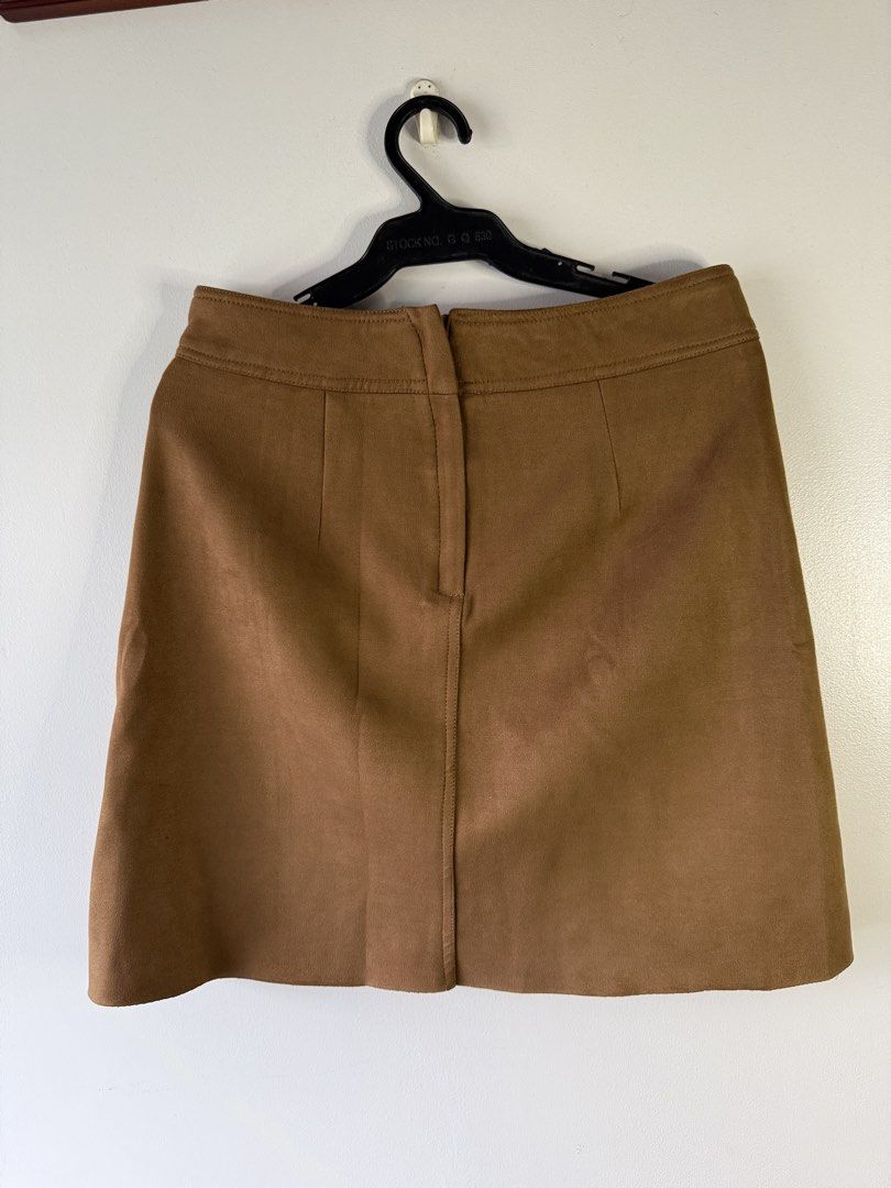 MO&CO. Brown Suede A-Line Mini Skirt (Category: Skirts) located in Makati City. Submitted by secondlife.inventory (Listing ID 1458766980, Image 2). Description: - Brand: MO&CO. - Material: Brown Suede - Style: A-line Mini Skirt with Lining - Features: Front Pockets - Versatility: Great for casual or dressed-up outfits - condition: 10/10 - fits M-L Pick Up BGC MOP GCash MariBank.