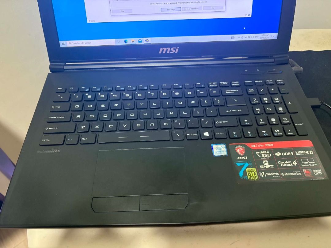 MSI GL62M 7RD (Category: Laptops & Notebooks) located in Los Banos. Submitted by emperana (Listing ID 1458805298, Image 3). Description: SEE PICS FOR SPECS. Storage is 460GB SSD. No other issues, aside from a small portion of the charger cable that was bitten by our dog. It has been secured with electrical tape. Works fine.