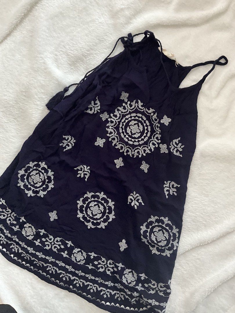 Navy Blue Embroidered with Tassels (Category: Sleeveless) located in Manila. Submitted by warm.secondchancefits (Listing ID 1458747968, Image 2). Description: - Adorable navy blue top - Features delicate white embroidered details all over - Adjustable straps for a perfect fit - Cute tassel details on the sides - Made from lightweight fabric, ideal for warm weather - Effortless to wear and style.