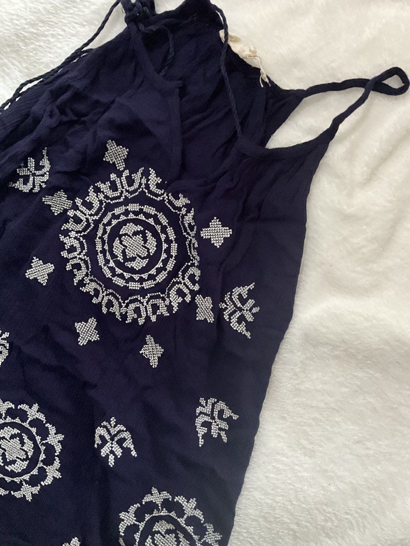 Navy Blue Embroidered with Tassels (Category: Sleeveless) located in Manila. Submitted by warm.secondchancefits (Listing ID 1458747968, Image 3). Description: - Adorable navy blue top - Features delicate white embroidered details all over - Adjustable straps for a perfect fit - Cute tassel details on the sides - Made from lightweight fabric, ideal for warm weather - Effortless to wear and style.