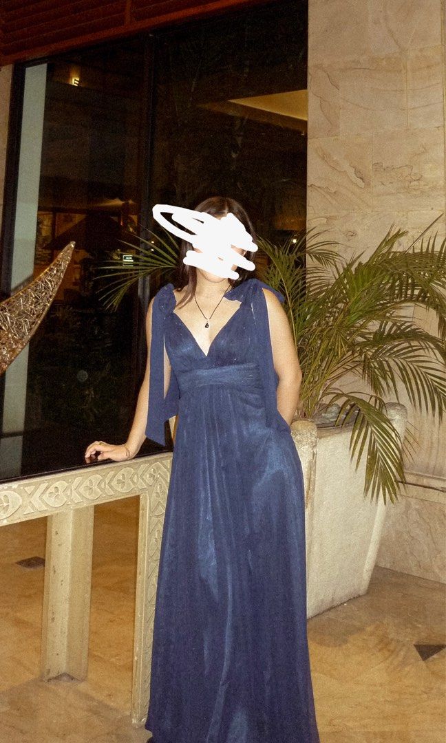 Navy Blue Formal Gown with Tie Shoulders (Category: Dresses) located in Makati City. Submitted by lecksie.pastfits (Listing ID 1458744395, Image 1). Description: - Heavy material - Beautiful navy blue formal gown - Flattering V-neckline - Cinched waist for a defined silhouette - Unique tie shoulder details - Elegant floor-length design - Ideal for weddings, parties, and special occasions - Worn only once.