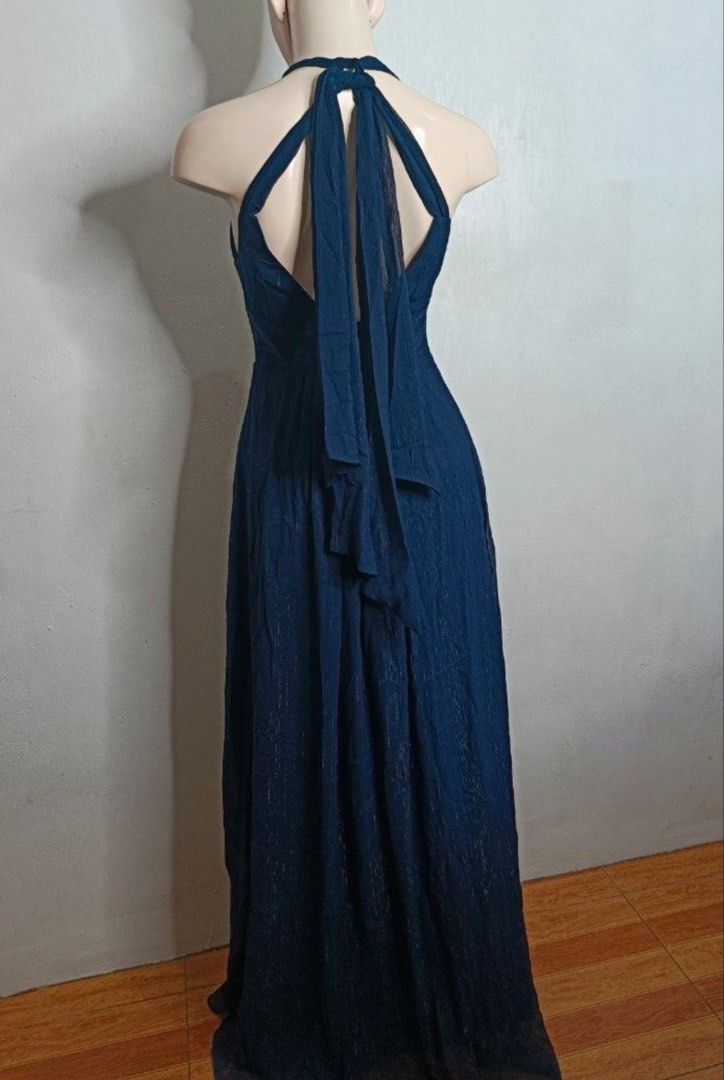 Navy Blue Formal Gown with Tie Shoulders (Category: Dresses) located in Makati City. Submitted by lecksie.pastfits (Listing ID 1458744395, Image 3). Description: - Heavy material - Beautiful navy blue formal gown - Flattering V-neckline - Cinched waist for a defined silhouette - Unique tie shoulder details - Elegant floor-length design - Ideal for weddings, parties, and special occasions - Worn only once.