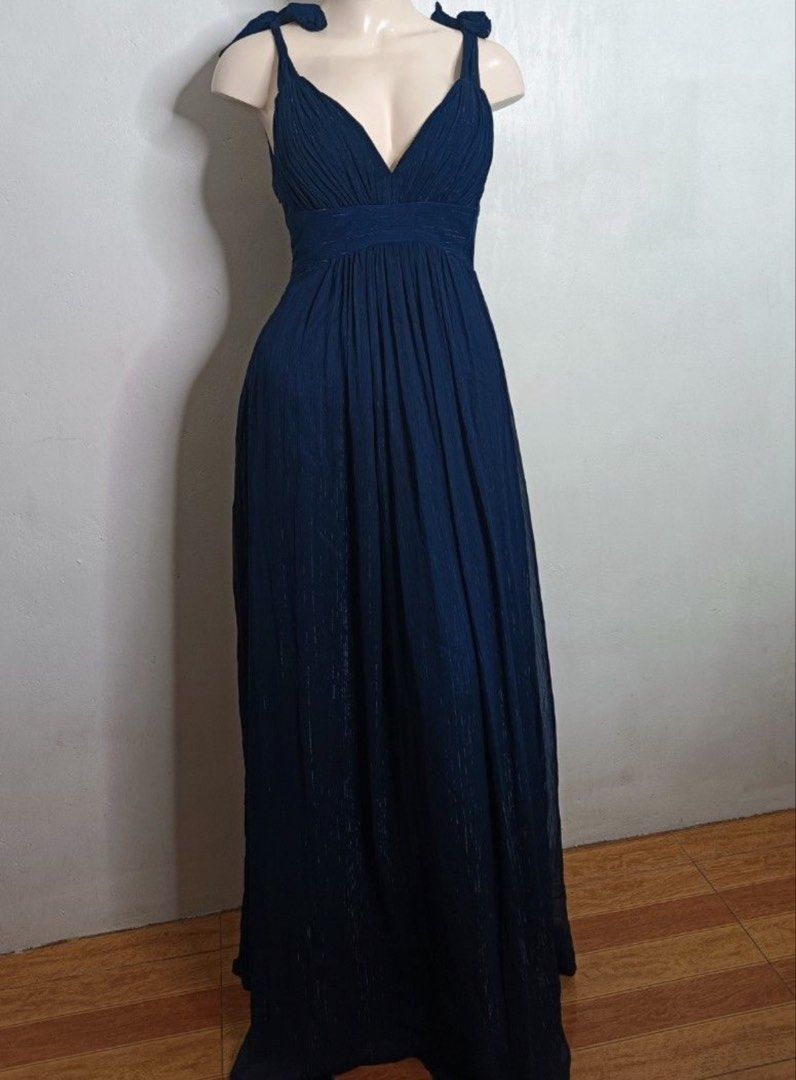 Navy Blue Formal Gown with Tie Shoulders (Category: Dresses) located in Makati City. Submitted by lecksie.pastfits (Listing ID 1458744395, Image 2). Description: - Heavy material - Beautiful navy blue formal gown - Flattering V-neckline - Cinched waist for a defined silhouette - Unique tie shoulder details - Elegant floor-length design - Ideal for weddings, parties, and special occasions - Worn only once.