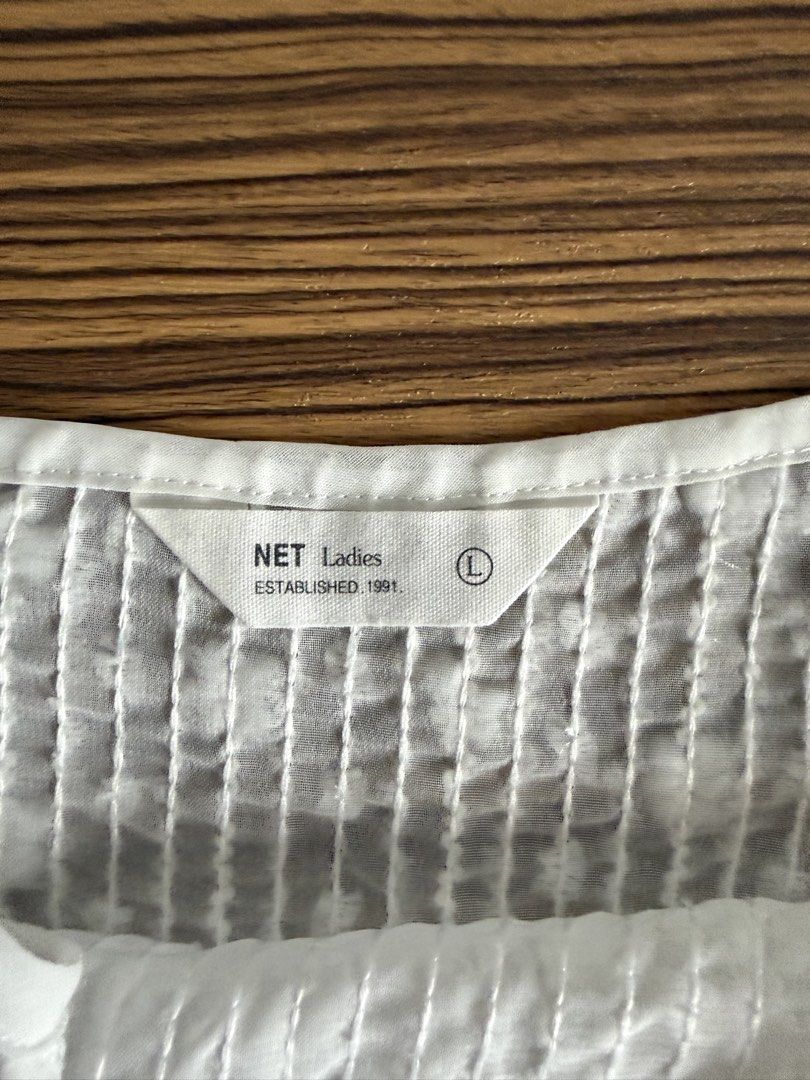 NET Ladies White Textured Camisole Top (Category: Sleeveless) located in Rizal. Submitted by prelovedbykash (Listing ID 1458749719, Image 2). Description: - never used - sheer - for layering/swimsuit cover up.