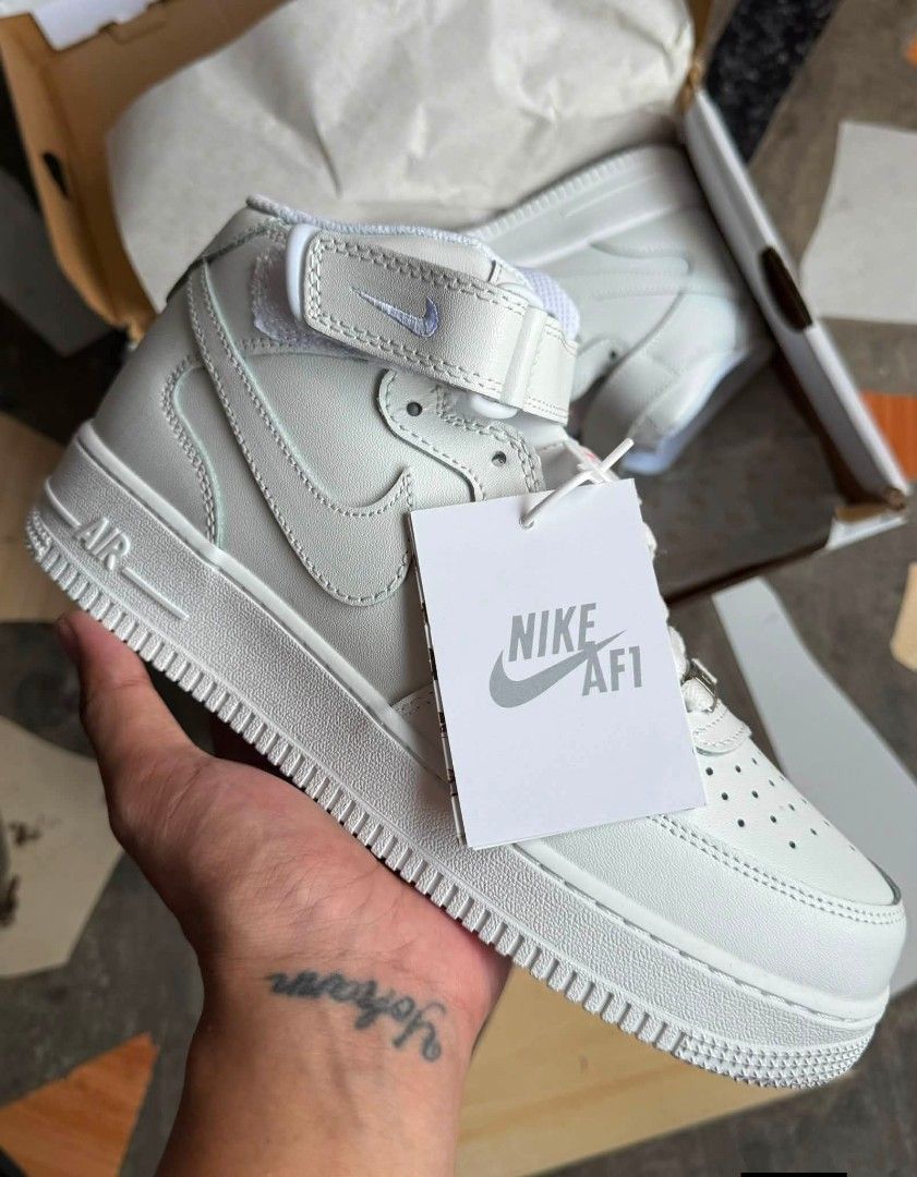 Nike Air Force 1 Mid White (Category: Sneakers) located in Manila. Submitted by yg_der (Listing ID 1458805804, Image 1). Description: - Classic Nike Air Force 1 Mids - Available in White or Black - Mid-top silhouette with adjustable ankle strap - Perforated toe box for enhanced breathability - Features iconic Nike Air cushioning for comfort - Ideal for everyday casual wear - Comes complete with original box -Available Sizes: US Men 8-11.