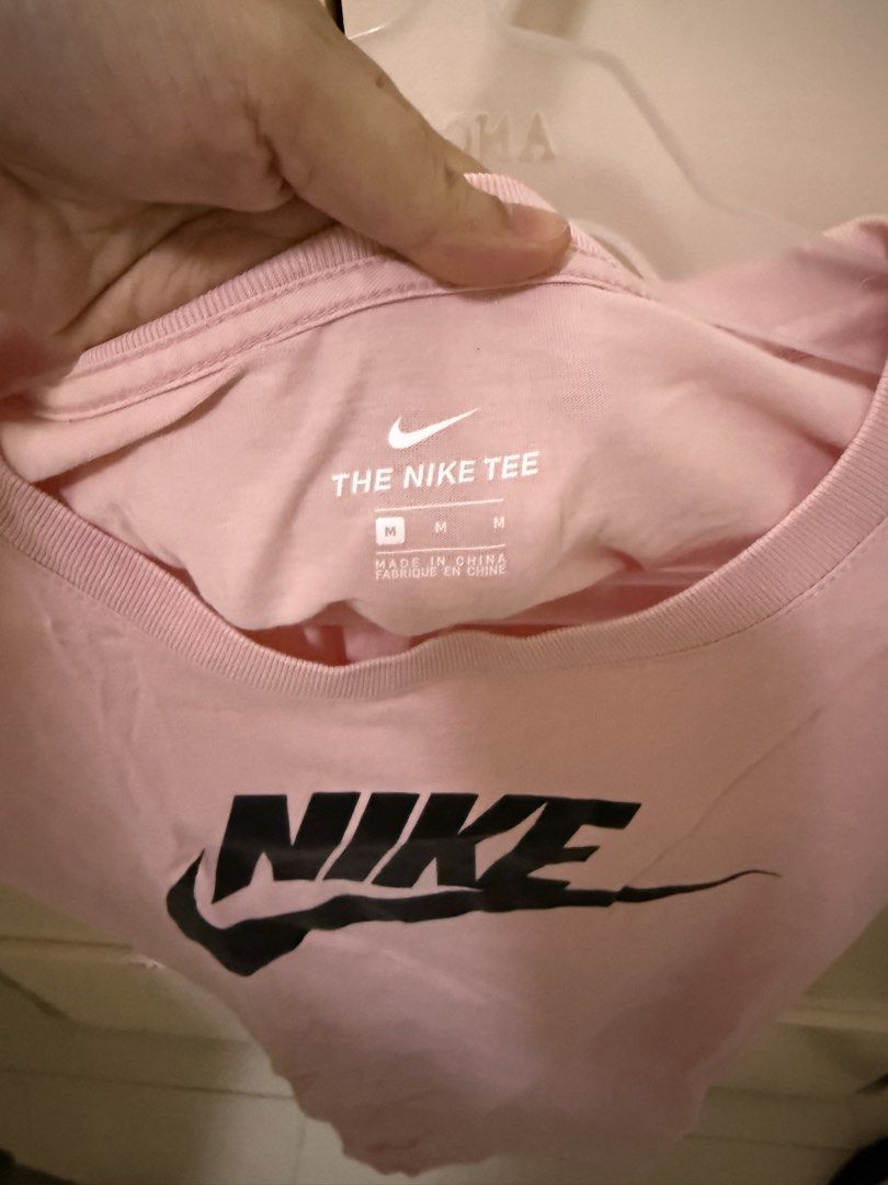 Nike Pink T-Shirt Tee Size M (Category: Shirts) located in Los Banos. Submitted by ramrammms (Listing ID 1458758951, Image 2). Description: - Pink Nike T-shirt - Classic Nike logo on front - Size: Medium (M) - Made in China - Perfect for everyday casual wear.