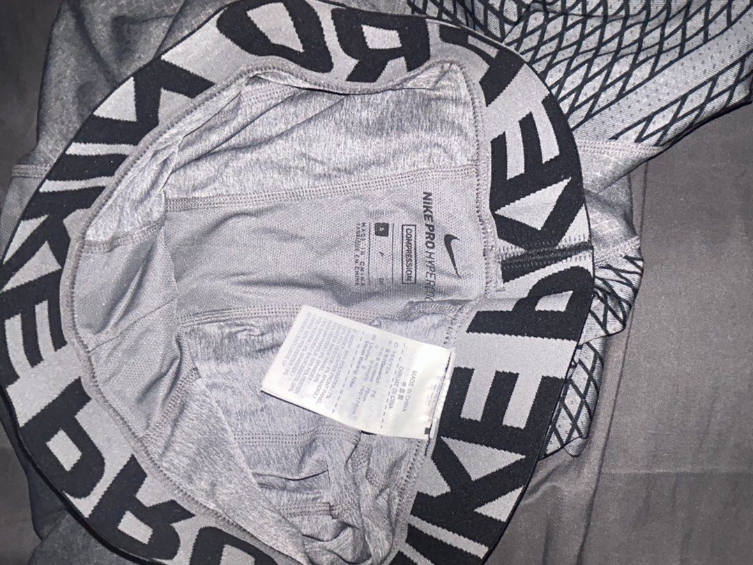 Nike Pro HyperStrong Compression Tights Grey (Category: Activewear) located in Taguig. Submitted by pre.loooved.co (Listing ID 1458788305, Image 2). Description: - Grey Nike Pro HyperStrong compression tights - Knee-length design (3/4) - Features the signature Nike Pro waistband - Textured pattern on the legs for added style and grip - Ideal for workouts, sports, and athletic activities - Provides excellent comfort and support during intense trai