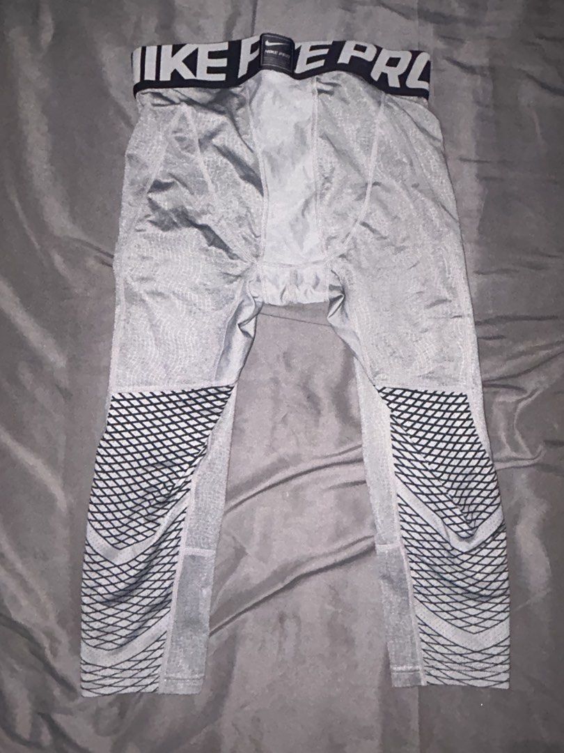 Nike Pro HyperStrong Compression Tights Grey (Category: Activewear) located in Taguig. Submitted by pre.loooved.co (Listing ID 1458788305, Image 3). Description: - Grey Nike Pro HyperStrong compression tights - Knee-length design (3/4) - Features the signature Nike Pro waistband - Textured pattern on the legs for added style and grip - Ideal for workouts, sports, and athletic activities - Provides excellent comfort and support during intense trai