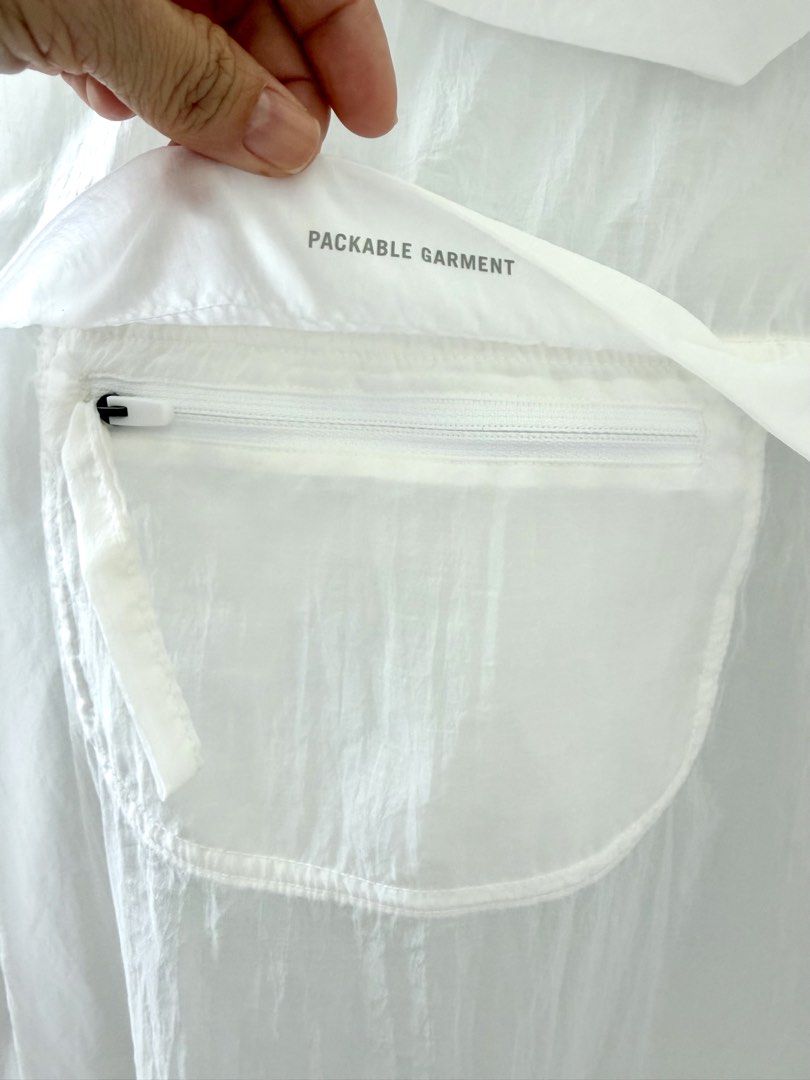 Nike Running Division Packable Windbreaker Jacket White (Category: Coats, Jackets and Outerwear) located in Lipa City. Submitted by pauline0303 (Listing ID 1458784418, Image 3). Description: - White Nike Running Division windbreaker jacket - Lightweight and packable design - Folds into its own pocket for easy storage - Features the iconic triple Nike swoosh on the back - Made in Cambodia - Ideal for running or everyday wear.