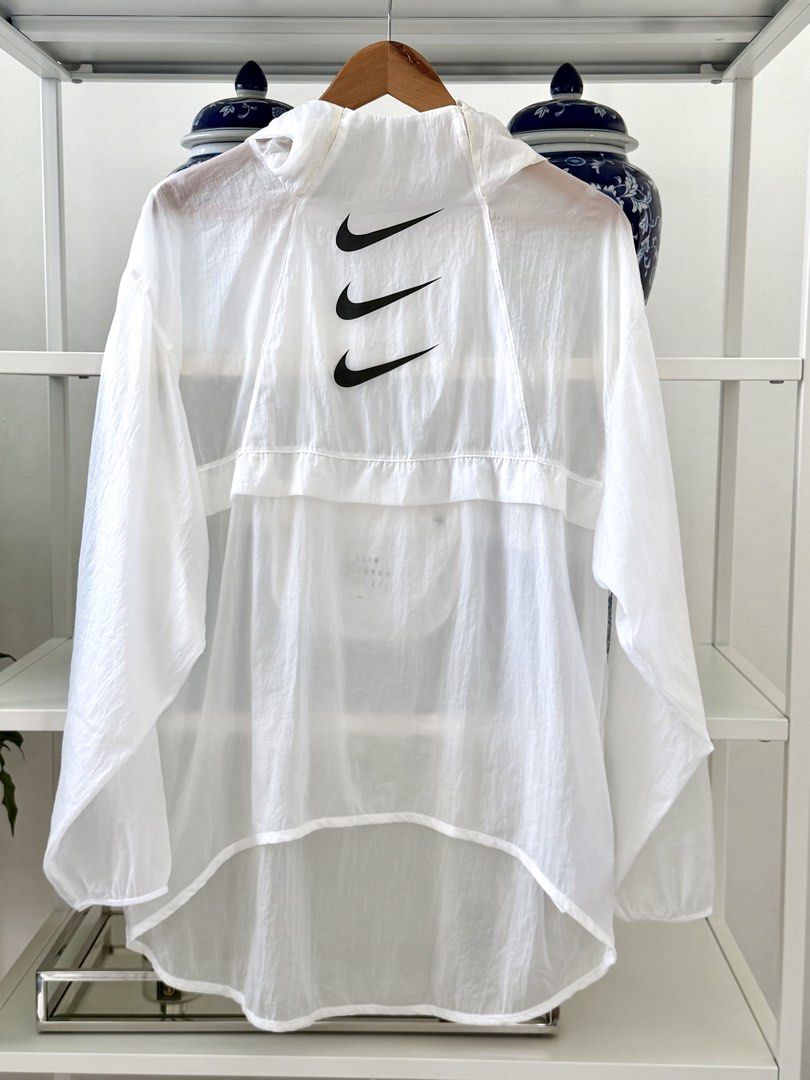 Nike Running Division Packable Windbreaker Jacket White (Category: Coats, Jackets and Outerwear) located in Lipa City. Submitted by pauline0303 (Listing ID 1458784418, Image 1). Description: - White Nike Running Division windbreaker jacket - Lightweight and packable design - Folds into its own pocket for easy storage - Features the iconic triple Nike swoosh on the back - Made in Cambodia - Ideal for running or everyday wear.