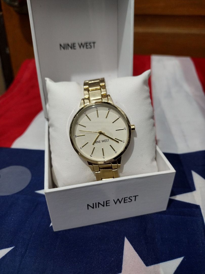 Nine West Gold Watch with White Face (Category: Women's Watches) located in Caloocan City. Submitted by cha_essentials2026 (Listing ID 1458861479, Image 1). Description: - Elegant Gold Nine West Watch - Classic White Face with Simple Hour Markers - Comes in Original Box - Versatile for Everyday or Dressy Occasions - A Timeless Accessory.