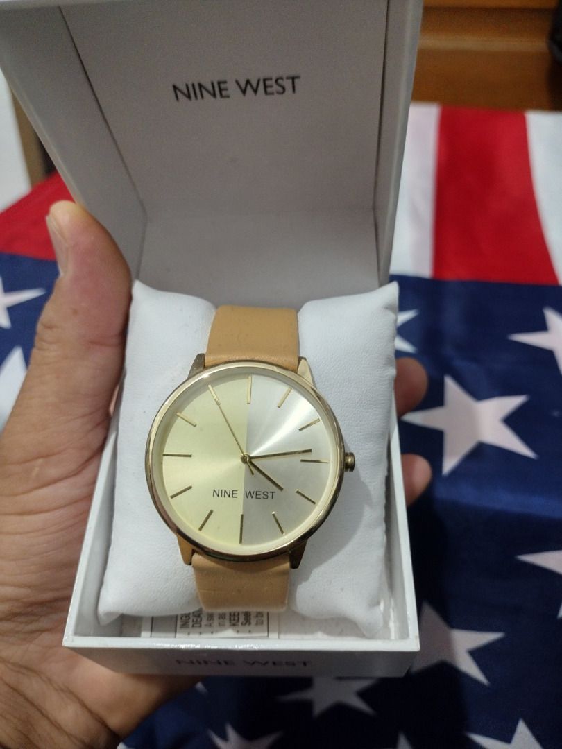 Nine West Watch with Tan Leather Strap (Category: Women's Watches) located in Caloocan City. Submitted by cha_essentials2026 (Listing ID 1458861419, Image 1). Description: - Brand: Nine West - Face Color: Gold-tone - Strap: Tan leather - Condition: Comes in original box - Style: Simple and classic, great for everyday wear.