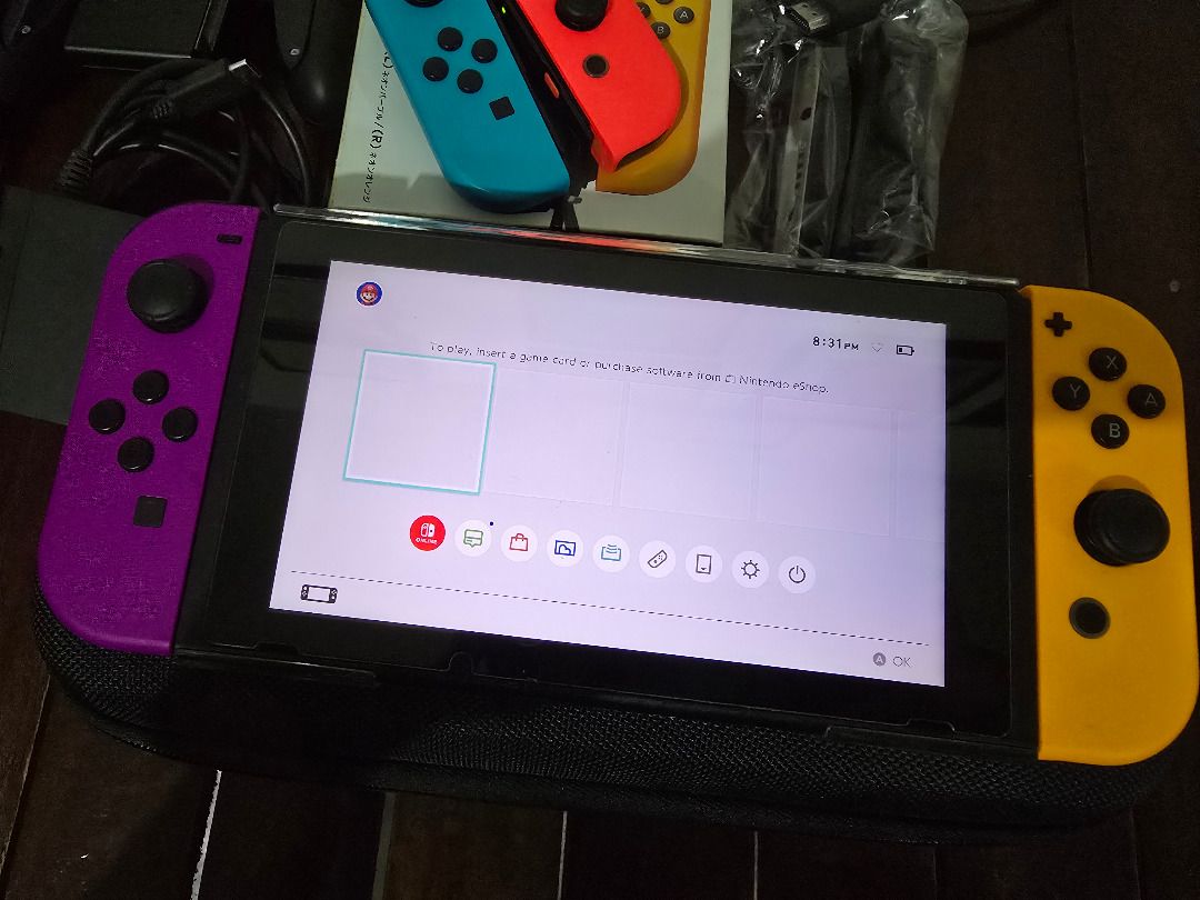 Nintendo Switch (V2) Console with Joy-Cons and Accessories (Category: Nintendo) located in Calamba. Submitted by basicallyodd23 (Listing ID 1458811035, Image 3). Description: FS: Nintendo Switch V2 (Hong Kong) With: - carrying case - SD card (128 GB) - extra Joycons (stick drift on left blue Joycon) - Joycon holder - charger w/ adapter - original HDMI cable - original box Meet-ups w/in Calamba City, Laguna only..
