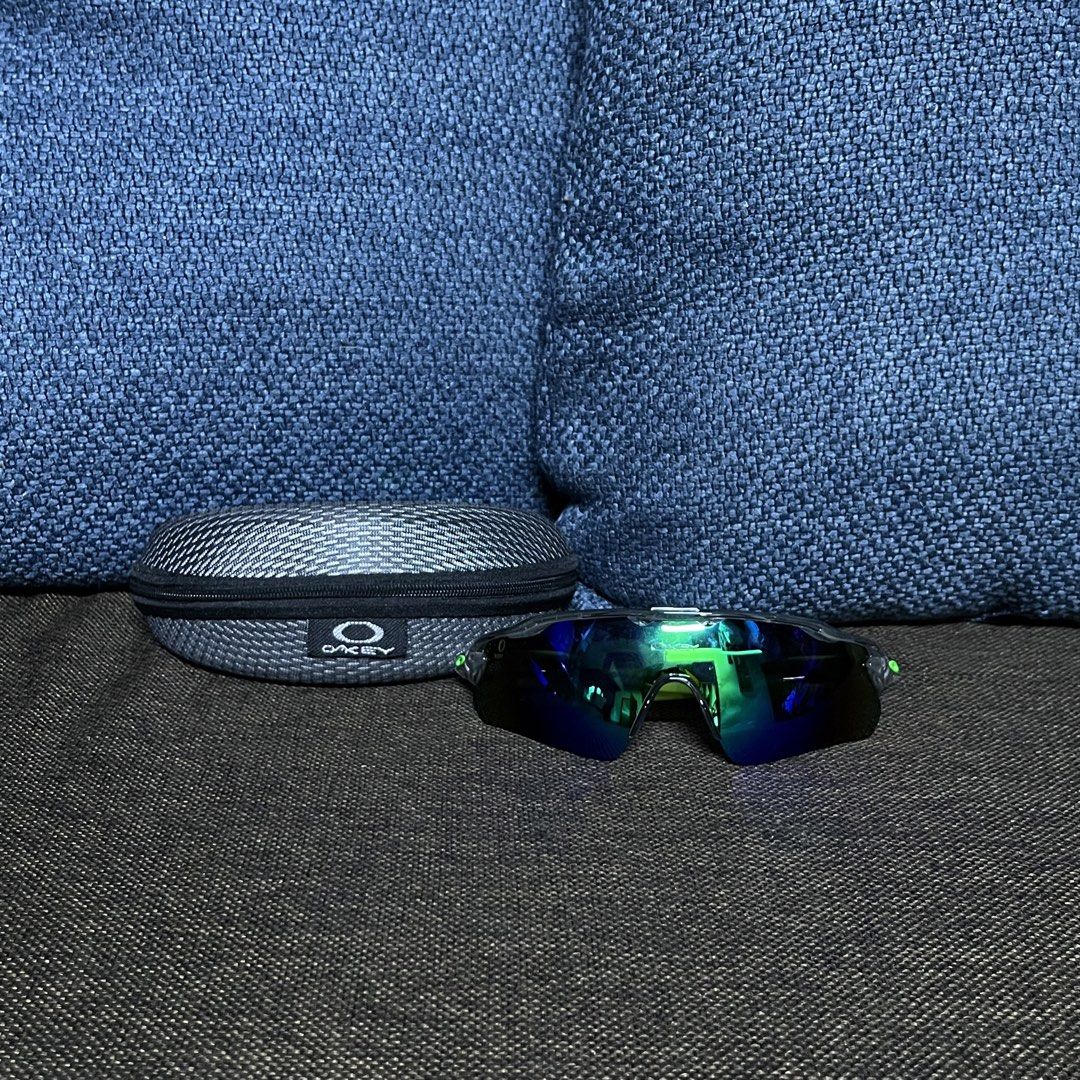 Oakley Sports Sunglasses (Category: Sunglasses & Eyewear) located in Masinloc. Submitted by mixoraph (Listing ID 1458697245, Image 1). Description: Oakley Sports Sunglasses – Green/Blue Lens Price ₱1,000 Description Oakley Sports Sunglasses 🕶️ • Green/Blue reflective lens • With hard case & cleaning cloth • Good condition • Stylish and sporty design • ₱1,000 only • PM for inquiries 📩.