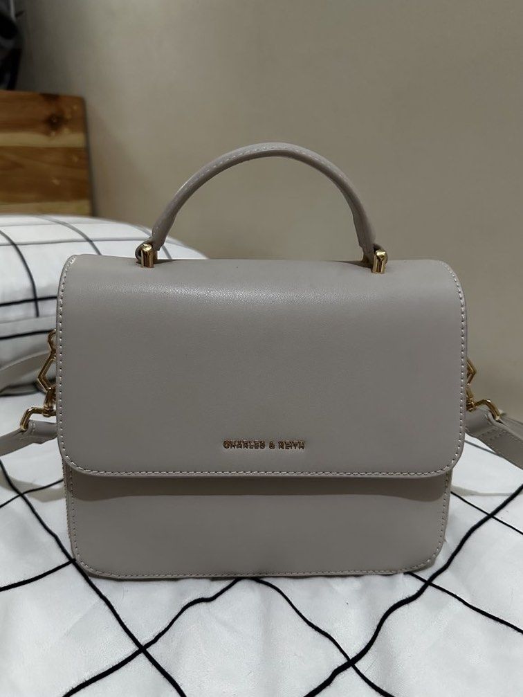 Octavia Front Flap Top Handle Bag - Ivory (Category: Cross-body Bags) located in Manila. Submitted by declutterwithmich (Listing ID 1458695071, Image 1). Description: - Almost new; used only once for ~1 hour - No original box or dust bag included.