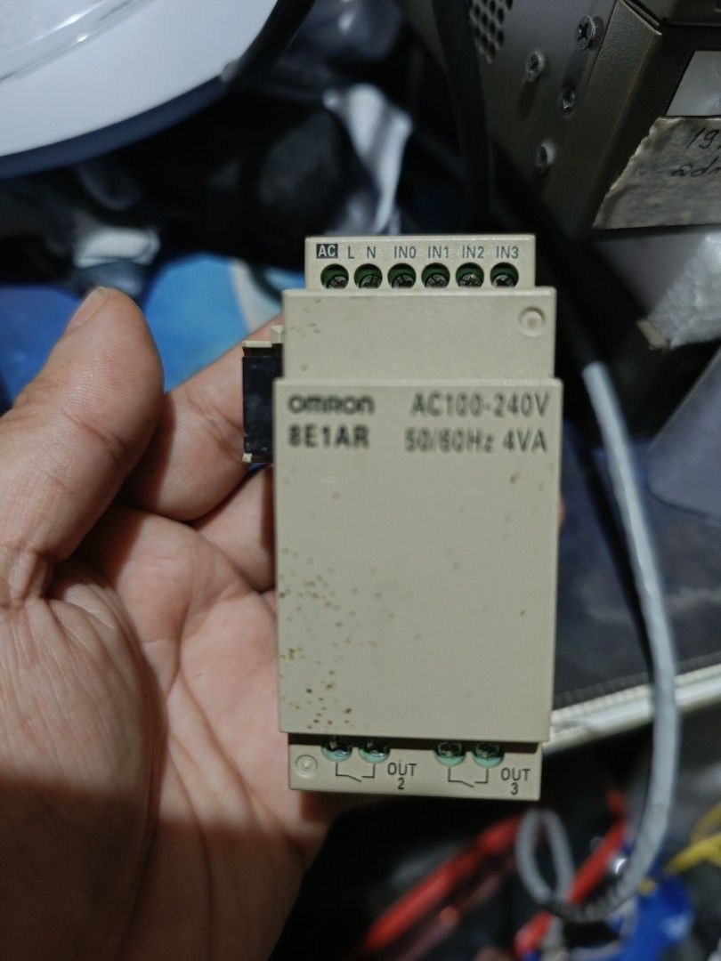 OMRON ZEN 10C1AR-A-V2 Programmable Relay. (Category: Electrical, Adaptors & Sockets) located in Makati City. Submitted by tioli_garage (Listing ID 1458691410, Image 3). Description: - OMRON ZEN 10C1AR-A-V2 Programmable Relay - Includes 8E1AR Expansion Unit - Both units are AC100-240V compatible - Main unit features a small LCD screen and navigation buttons - Expansion unit provides additional output terminals - Ideal for various automation projec