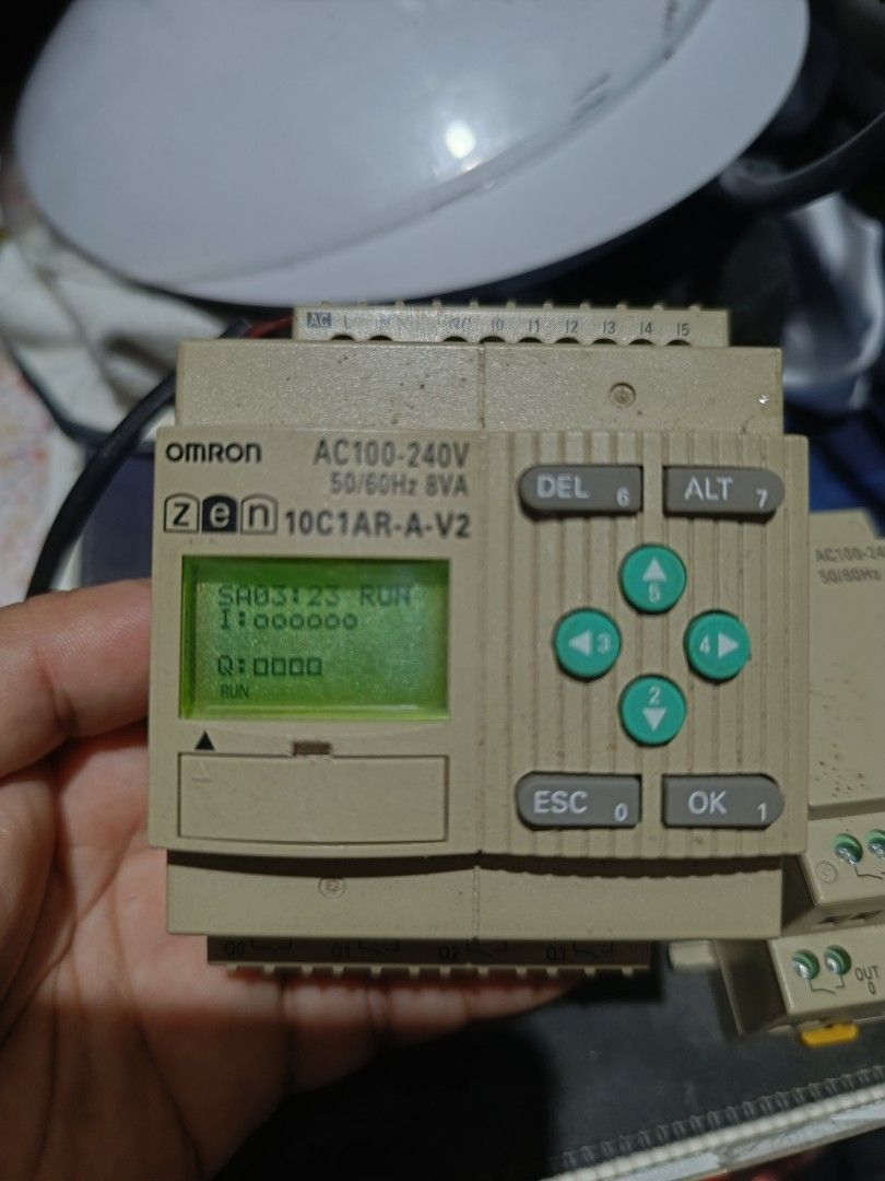 OMRON ZEN 10C1AR-A-V2 Programmable Relay. (Category: Electrical, Adaptors & Sockets) located in Makati City. Submitted by tioli_garage (Listing ID 1458691410, Image 2). Description: - OMRON ZEN 10C1AR-A-V2 Programmable Relay - Includes 8E1AR Expansion Unit - Both units are AC100-240V compatible - Main unit features a small LCD screen and navigation buttons - Expansion unit provides additional output terminals - Ideal for various automation projec