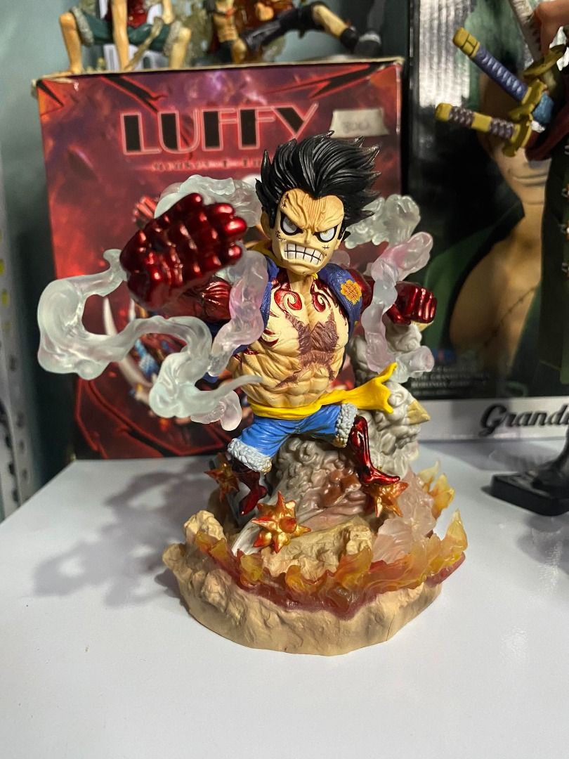 One Piece Luffy Gear 4 Action Figure (Category: Figurines & Statues) located in Angeles City. Submitted by rickki_t (Listing ID 1458840960, Image 1). Description: - Gear 4 Monkey D. Luffy Action Figure - Bootleg HQKO - Dynamic pose capturing intense action - Fiery effects at the base for a powerful display - Must-have for any One Piece fan's collection - Box is included.