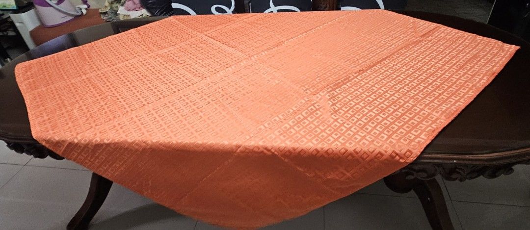 Orange Textured Tablecloth for Dining Table (Category: Table Linen & Textiles) located in Caloocan City. Submitted by rm.diaz (Listing ID 1458783744, Image 1). Description: - Vibrant orange tablecloth - Subtle square pattern - Durable fabric, built to last - Perfect for 6-seater dining tables or as a decorative accent - Measures 55 x 52 inches - Ready to add a pop of color to your home!.