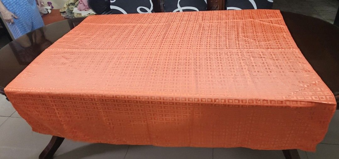 Orange Textured Tablecloth for Dining Table (Category: Table Linen & Textiles) located in Caloocan City. Submitted by rm.diaz (Listing ID 1458783744, Image 2). Description: - Vibrant orange tablecloth - Subtle square pattern - Durable fabric, built to last - Perfect for 6-seater dining tables or as a decorative accent - Measures 55 x 52 inches - Ready to add a pop of color to your home!.