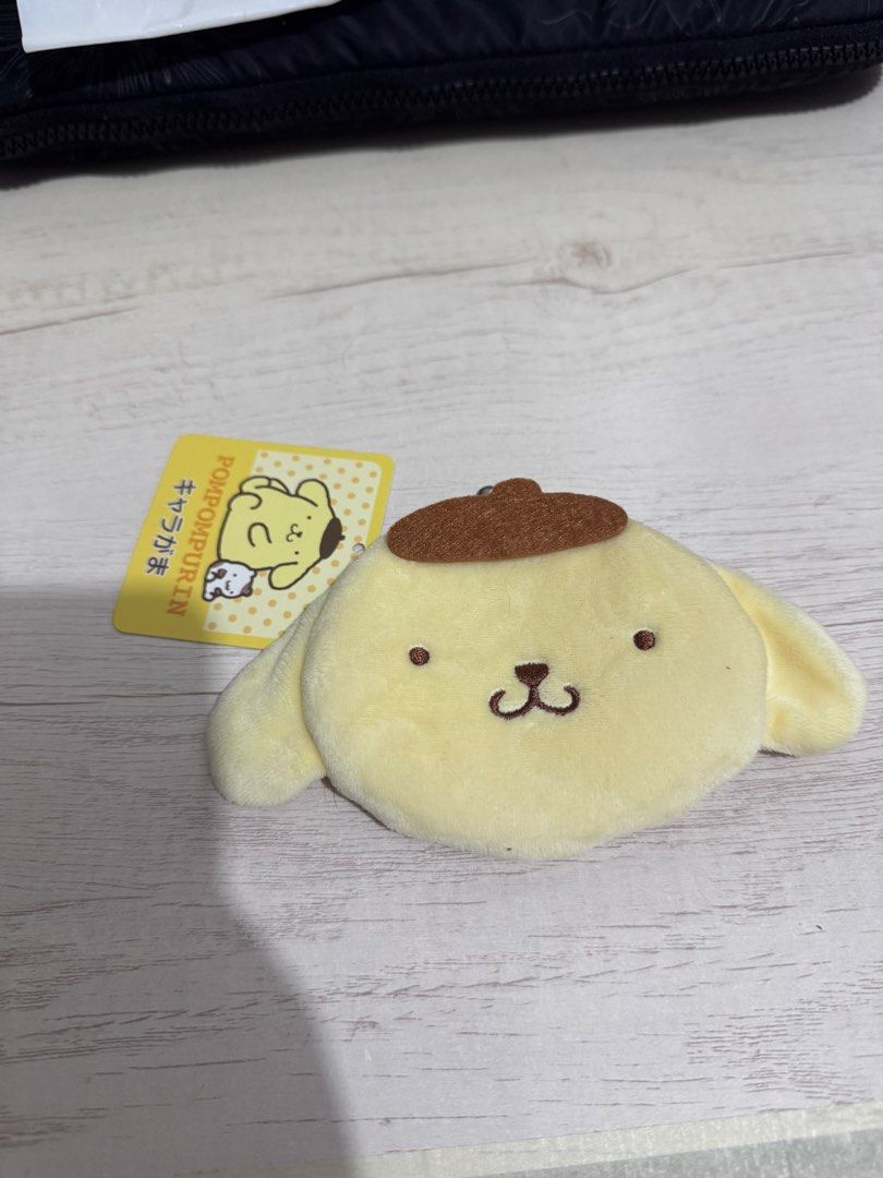 Original Sanrio Pompompurin Coin Purse (Category: Wallets & Card holders) located in Mandaluyong City. Submitted by minasitems (Listing ID 1458838060, Image 1). Description: Good as new! Super cute. Bought from Japan 📌 MOP: GCash 📌 MOD: Lalamove/Grab, J&T, GGX, LBC 📌 Location: Mandaluyong/Ortigas.