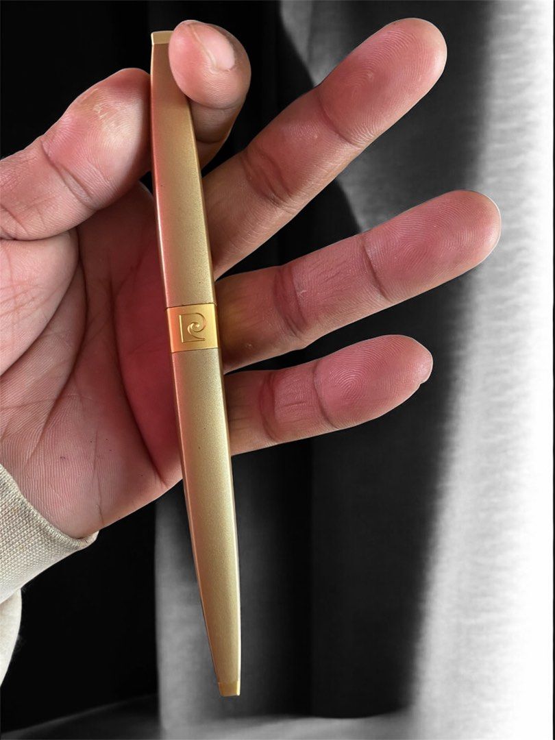 Pierre Cardin Gold Ballpoint Pen (Category: Stationery & School Supplies) located in General Trias. Submitted by mangu_ukay (Listing ID 1458786480, Image 1). Description: - Genuine Pierre Cardin gold ballpoint pen - Features signature logo on the clip - Shows minor scuffs and discoloration on barrel (normal wear) - Writes smoothly and reliably - A timeless writing accessory.