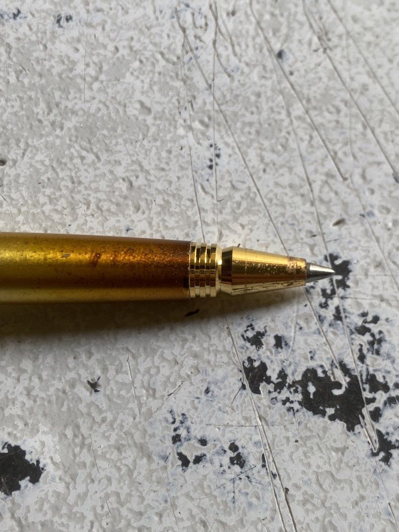 Pierre Cardin Gold Ballpoint Pen (Category: Stationery & School Supplies) located in General Trias. Submitted by mangu_ukay (Listing ID 1458786480, Image 2). Description: - Genuine Pierre Cardin gold ballpoint pen - Features signature logo on the clip - Shows minor scuffs and discoloration on barrel (normal wear) - Writes smoothly and reliably - A timeless writing accessory.