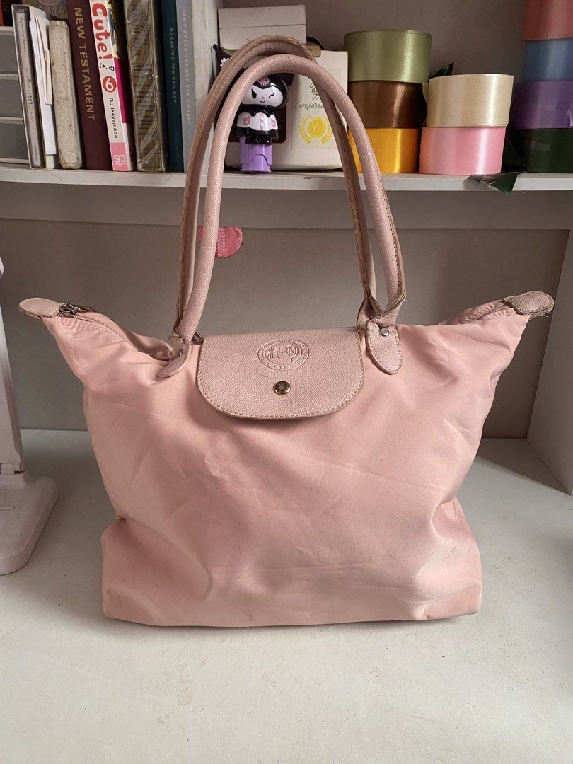 PINK LONGCHAMP INSPIRED BAG (Category: Shoulder Bags) located in Muntinlupa City. Submitted by arimisu (Listing ID 1458764054, Image 1). Description: Hello selling this longchamp inspired bag! got it before on my training on shanghai china! only used few times and still on good condition! let me know if you’re interested so i can send more photos of the item Pink color • Spacious interior • Easy to carry • Great for school, office, or casual use 