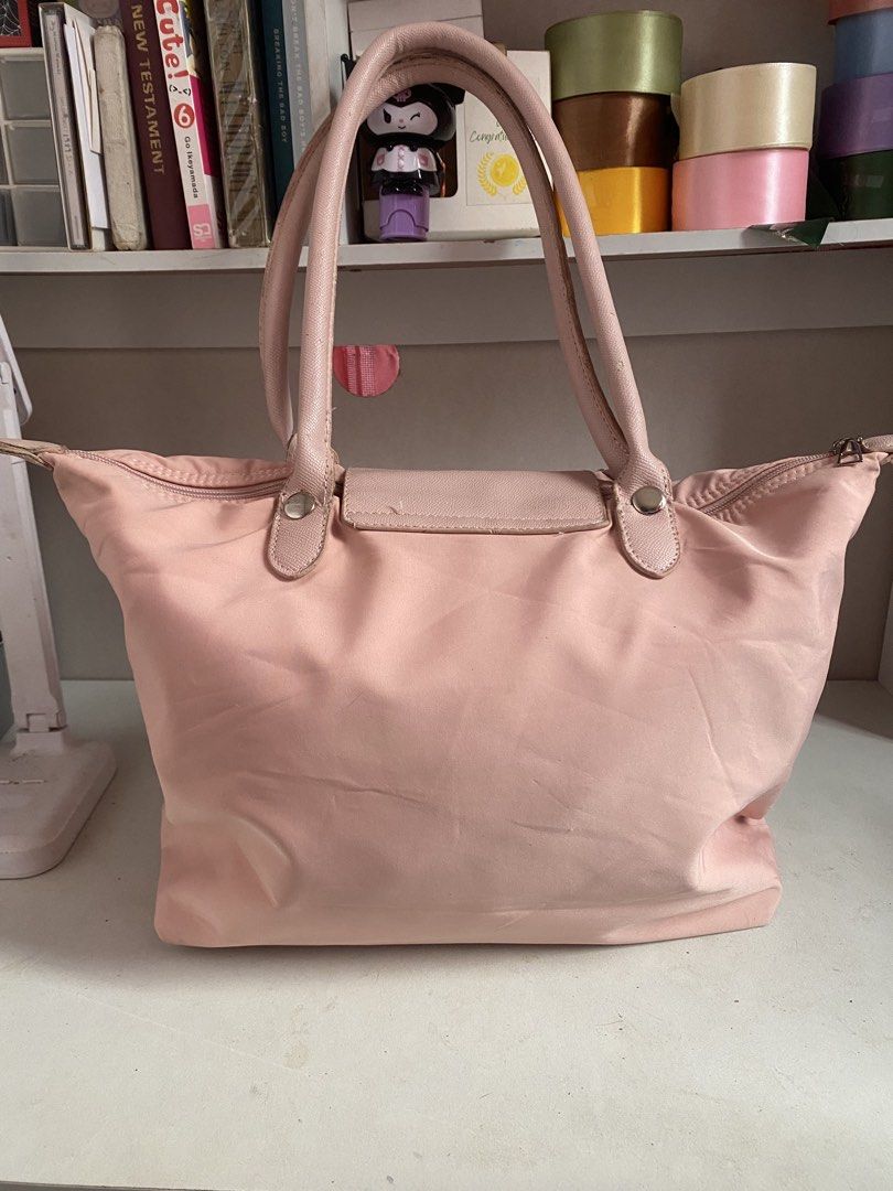 PINK LONGCHAMP INSPIRED BAG (Category: Shoulder Bags) located in Muntinlupa City. Submitted by arimisu (Listing ID 1458764054, Image 2). Description: Hello selling this longchamp inspired bag! got it before on my training on shanghai china! only used few times and still on good condition! let me know if you’re interested so i can send more photos of the item Pink color • Spacious interior • Easy to carry • Great for school, office, or casual use 