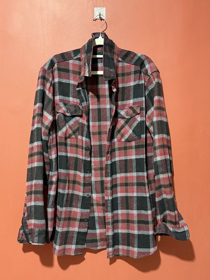 Plaid Flannel Shirt (Category: Coats, Jackets and Outerwear) located in Imus. Submitted by anywhere_angel (Listing ID 1458760815, Image 1). Description: - Classic red, black, and grey plaid pattern - Button-up front closure - Two chest pockets - Long sleeves with button cuffs - Comfortable and warm for casual wear - Ideal for layering.
