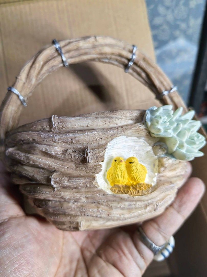 Polyresin Wicker Basket Planter (Category: Pots & Planters) located in Cebu City. Submitted by dudes_villanueva (Listing ID 1458696089, Image 3). Description: Polyresin Wicker Basket Planter Brand New with Box 📌 Featuring a cute little bird's nest with two yellow chicks and an attached succulent detail. L5.25xW3.75xH4.75 (Handle included).