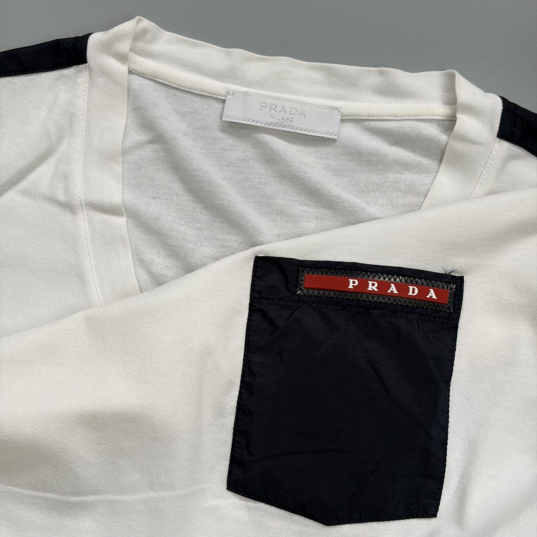 (Sale)Prada nylon Pocket tee (Category: Luxury Apparel) located in Cavite. Submitted by onebeancent (Listing ID 1458776181, Image 3). Description: 🔘Pr4.da Soft Vneck Nylon Pocket tee Size: Medium Frame Dimension: 20" Width | 27" Length Color: White Color Rate: 9/10 Issue: 1 pinhole Condition: Very Good Befoee: 560php Now: 350php Additional Shipping Fee (J&T Small Pouch) 75php Luzon 100php visayas 120php mindanao.