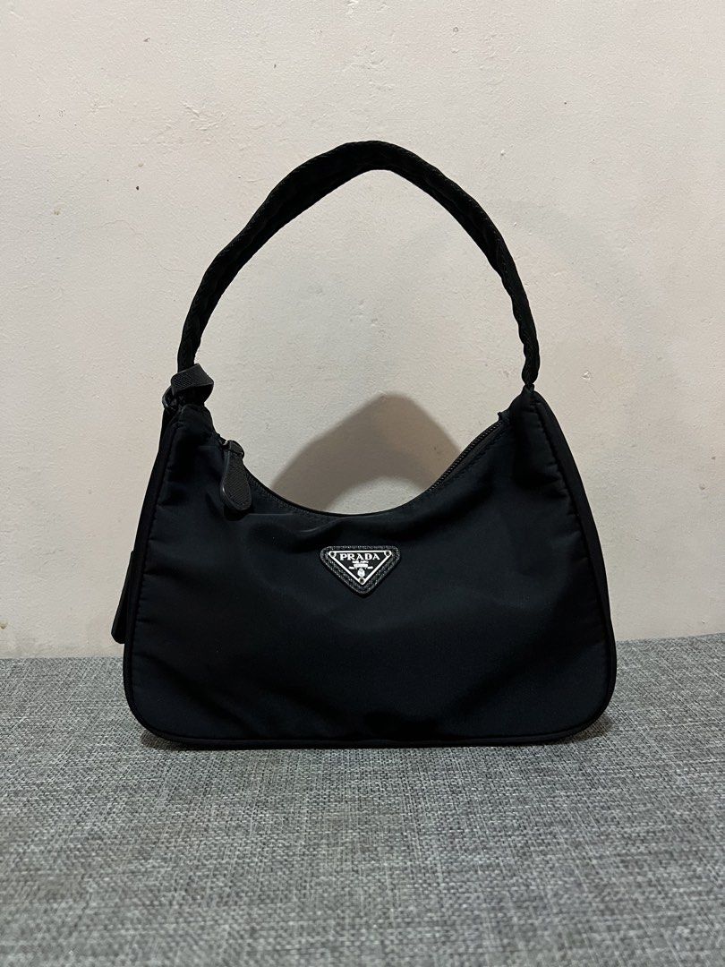 Prada Re-Edition 2000 Nylon Shoulder Bag Black (Category: Luxury Bags & Wallets) located in Valenzuela. Submitted by cc_c__cc (Listing ID 1458856881, Image 1). Description: As is No inclusions Signs of use Rfs. Decluttering unused bags Need funds.