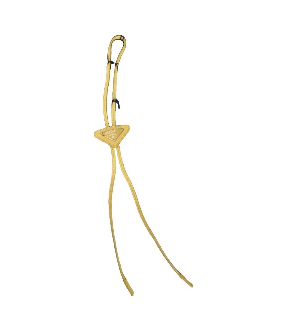 Prada Yellow Leather Triangle Logo Bolo Necktie (Category: Ties) located in Manila. Submitted by jponfashionspeed (Listing ID 1458850817, Image 1). Description: - Authentic Prada bolo leather necktie - Bright yellow leather - Iconic Prada triangle logo - Made in Italy - Comes with original tags - Adds a pop of color to any outfit - Great for gifting or personal use.