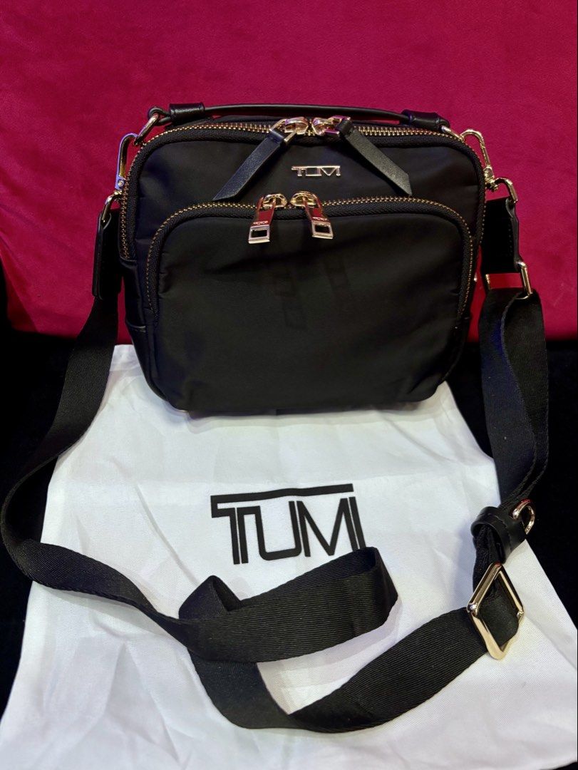 Preloved Teghan Crossbody Bag (Category: Cross-body Bags) located in Malolos. Submitted by cheerz21 (Listing ID 1458779406, Image 2). Description: Preloved Tumi Teghan Crossbody Bag •Nylon, water-proof bag •With dust bag; Top Notch/ OG quality •Double-zip entry to main compartment •Back open pocket with hidden magnetic snap closure • Collapsible leather top handle •Removable and adjustable strap • Monogrammable detachable leather charm • 4 metal 