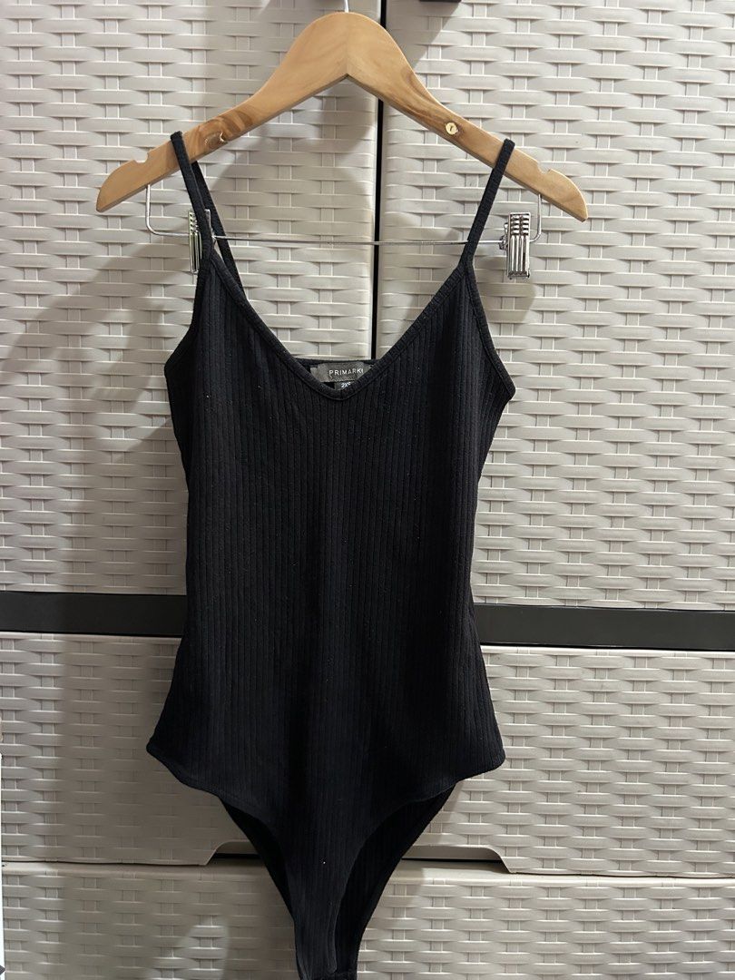 Primark Black Ribbed Spaghetti Strap Bodysuit (Category: Sleeveless) located in San Jose. Submitted by abbsc. (Listing ID 1458718178, Image 1). Description: - Brand: Primark - Small-med in siz - Color: Black - Style: Ribbed bodysuit - Features: Spaghetti straps, V-neckline - Closure: Snap button at crotch - Material: Stretchy for comfort - Versatile basic piece.